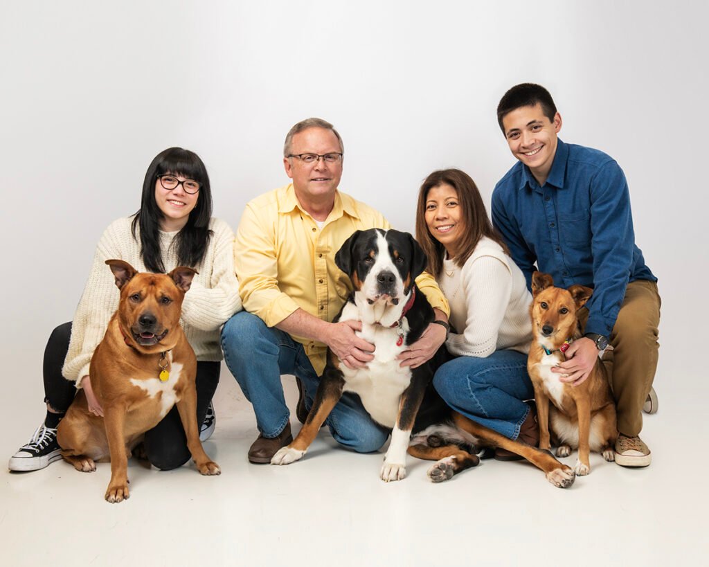 Studio family portrait including dogs