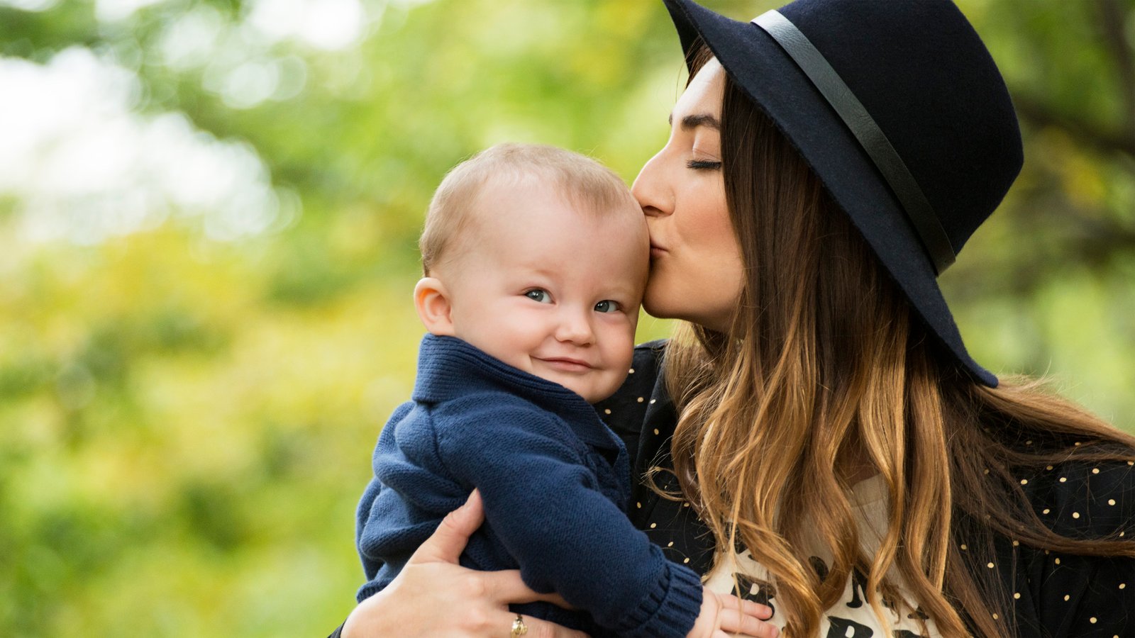 mother kissing baby son