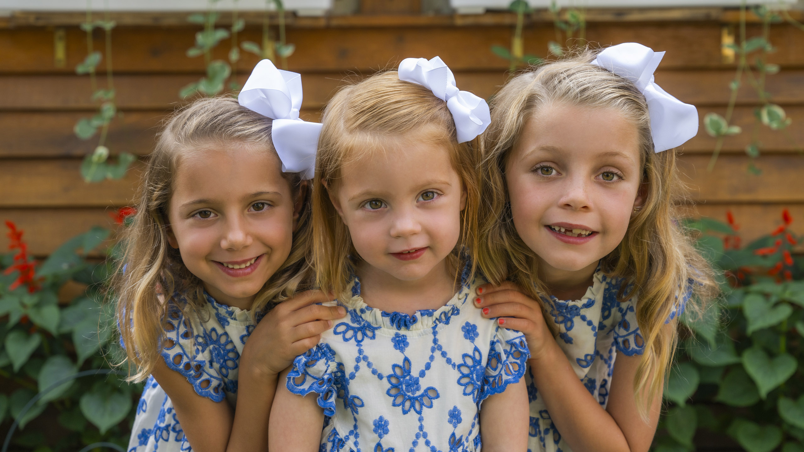 photo of three little girls outside