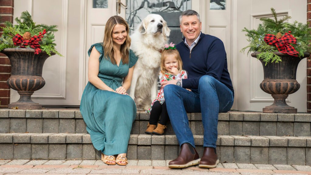 Family portrait outside their home