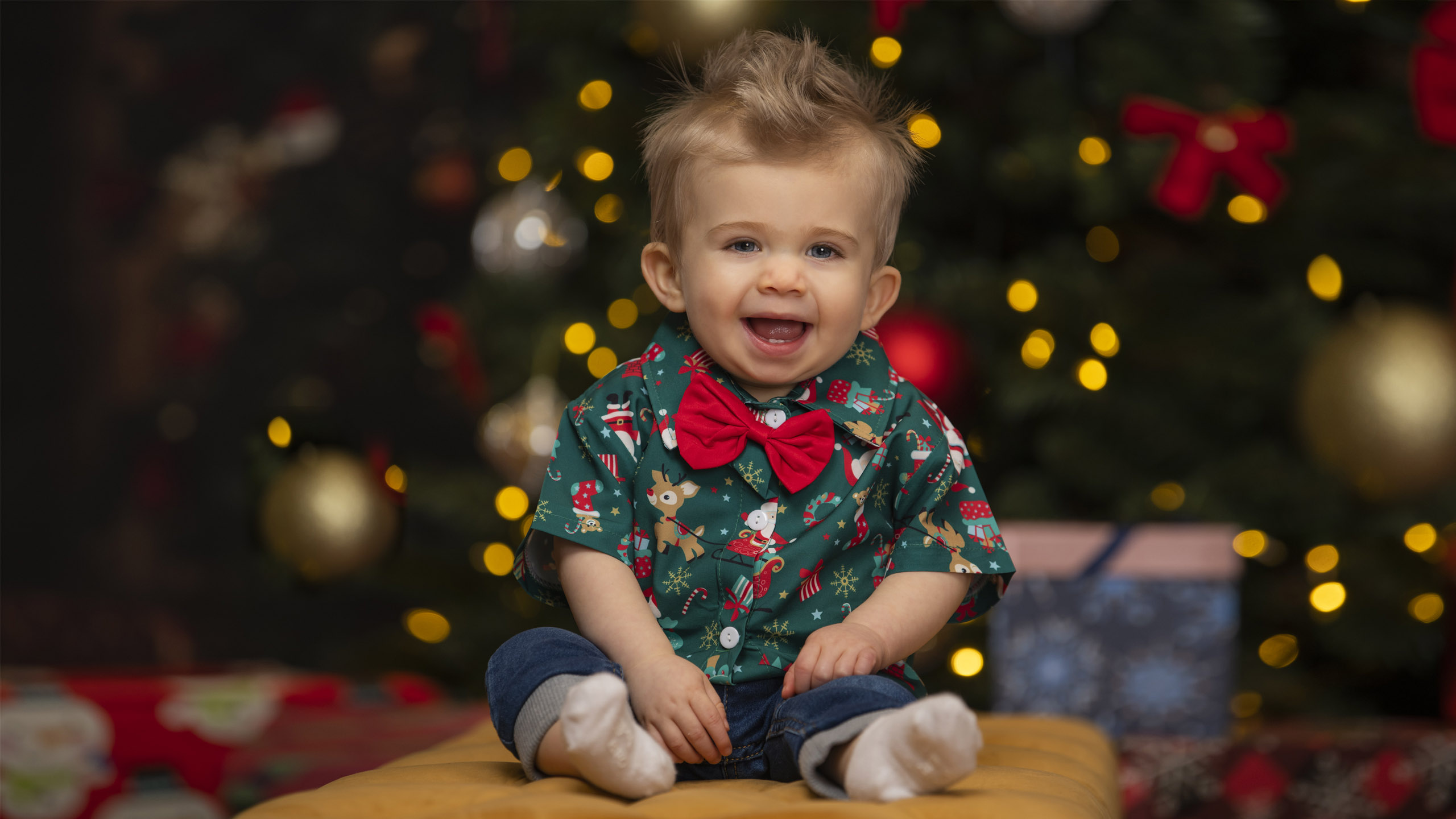 studio christmas photo of a baby smiling